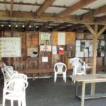 Control Shack with frequency board, first aid, bulletin board, chairs and weather station.